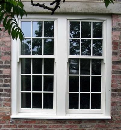 Two white vinyl double hung windows